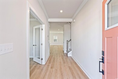 Hall with light hardwood / wood-style floors and o