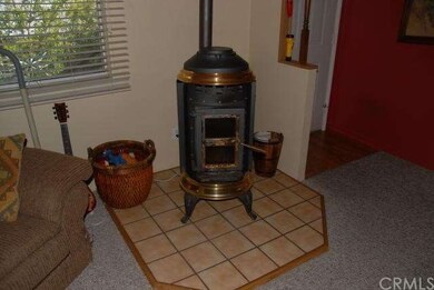 Charming pellet stove at entry.