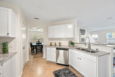 New granite countertops and new tile floors accent this lovely kitchen.