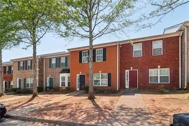 Townhome / multi-family property featuring brick s