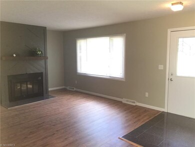 This is just another view of the living room showing the front of the home   And the granite foyer