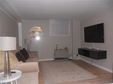 Living room with wood flooring and...