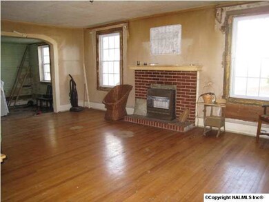 living with fireplace nice hardwood floors plenty of windows