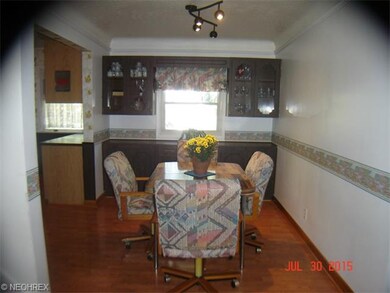 Eat-in area of kitchen has laminate flooring (hard