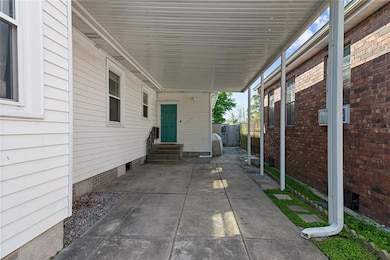 This carport is over 14 feet wide so easy in and o