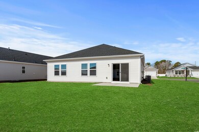 Rear view of property featuring central AC, a pati