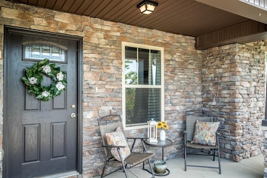 Sweet front porch with views of majestic horses on a horse farm.