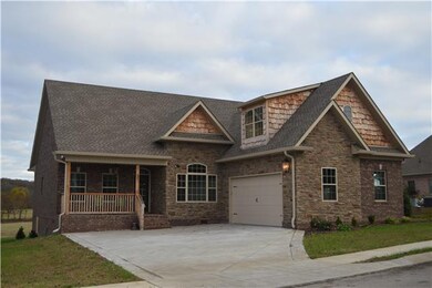 2 Car Garage. Notice the cedar shake trim and the unique stack stone accents.