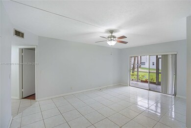 Living Room Features Sliding Door to the Screened Patio