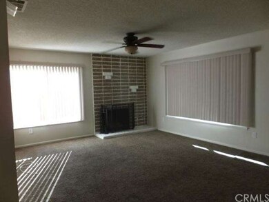 Living room has fireplace with gas logs