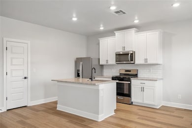 Stunning kitchen with granite countertops and subway tile backsplash.