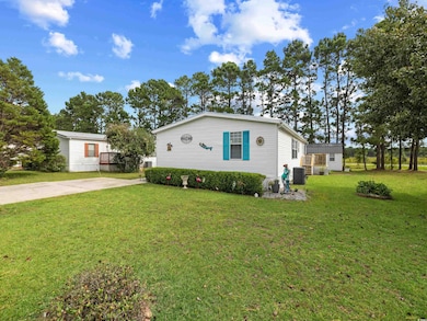View of front facade with a front yard and central