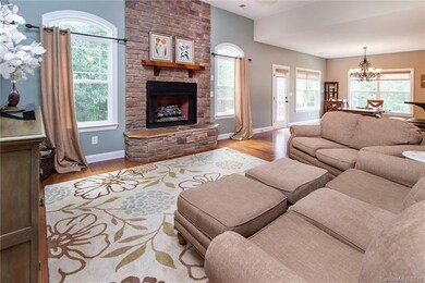 Main level is so inviting with hardwood floors, op