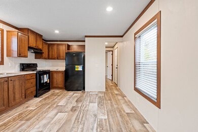 View of the central living space connecting to the kitchen and hallway