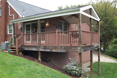 Side view of the home, focusing on the back deck w