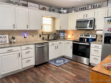 Large open kitchen with granite countertops & stai