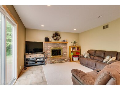 Family room with cozy wood burning fireplace