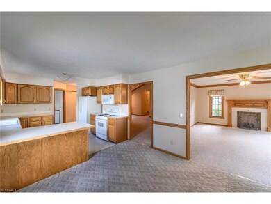 Kitchen with easy access to Family Room with Firep