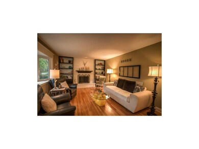 Elegant formal room with fireplace, built-ins, and