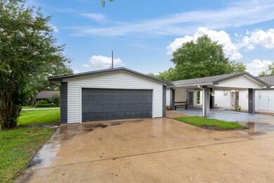 Home equipped with a 2-car garage and 2-car carpor