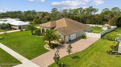 Paver Driveway and Three-Car Garage