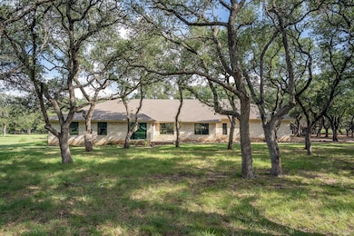 Ranch-style home featuring brick siding and a fro