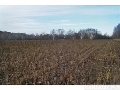Field bordered by hardwoods.