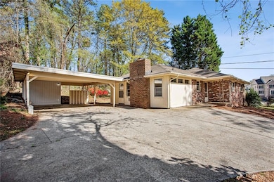 Spacious 2 car carport and turnaround parking area