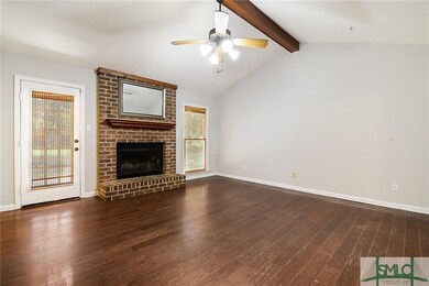 Wood floors throughout foyer, living room and dini