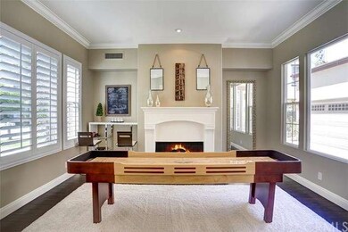 Formal living area with crown moldings, plantation