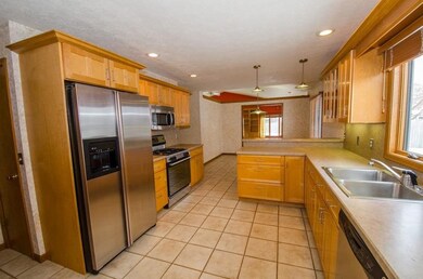 Abundance of newer maple cabinetry and stainless s