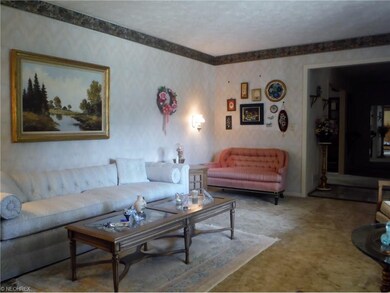 Formal living room is spacious enough to accommoda