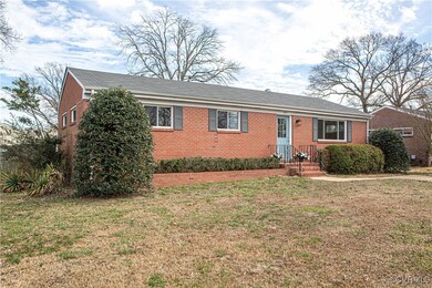 Single story home featuring a front lawn and brick