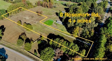 Aerial view of property and surrounding area with property parcel outlined