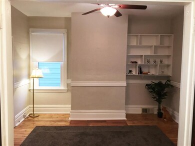 Living Room features pine hardwood floors and orig