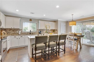 Updated kitchen with granite, tile back splash and large island