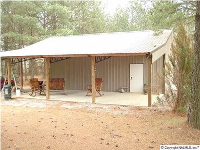COVERED PORCH WITH CONCRETE FLOOR OFF SIDE OF THE BARN. PERFECT FOR OUTDOOR GATHERINGS