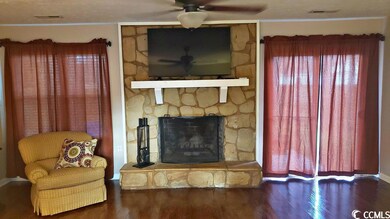 13x19 large living room with wood burning fireplac