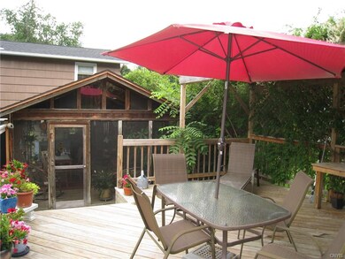 Deck area.  The foliage on the trellis adds natura