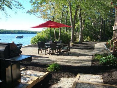 Exterior Back. Patio table and grill area to relax