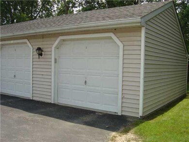 Parking Lot/Garage Separate garage with storage