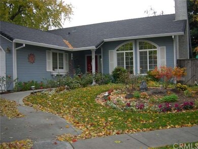 Beautiful entry with roses and circular flower bed
