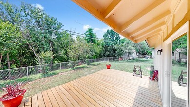 Wooden deck with view of scattered trees