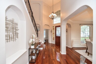 This elegant home entryway features high ceilings,