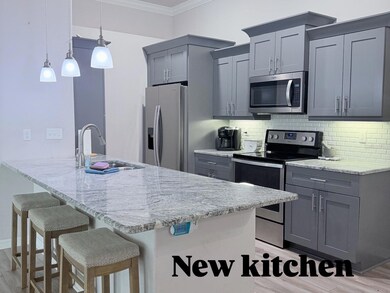 Modern Kitchen with stainless steel appliances, granite countertops, and plenty of cabinet space