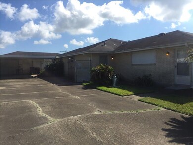 side driveway with covered area and garage/storage