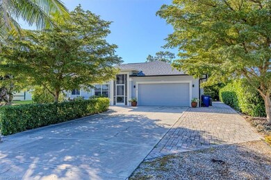View of front facade featuring driveway, an attached garage, a shingled roof, and stucco siding