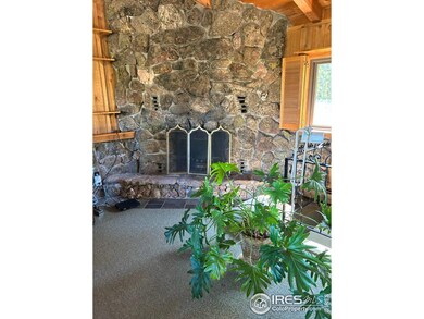 Warm yourself by a log fire in this beautiful moss rock fireplace