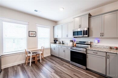 Kitchen featuring stainless steel appliances, gray