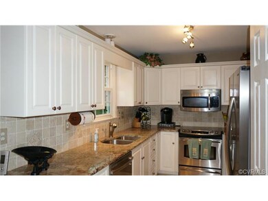 Renovated kitchen wit new cabinets, counters, ligh